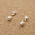 Boucles d'oreilles goutte amovibles argent sur surface