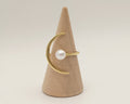Pearl mounted on a gold adujstable ring in the shape of moon