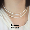Gold baroque freshwater pearl long necklace on model with droplet end, by Bijou Nacre